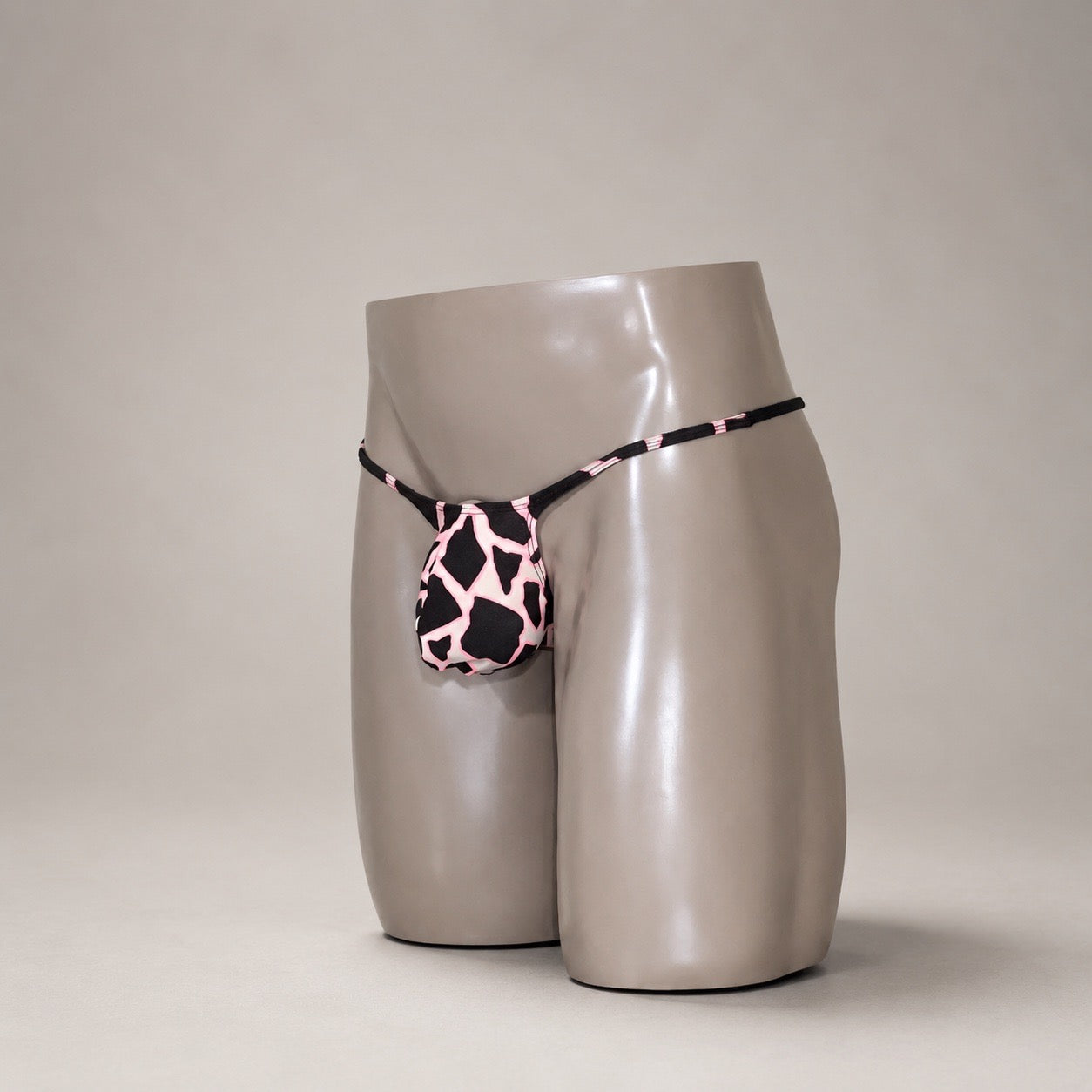 SideView of Pink Safari black and pink animal-print men's Muscle thong by PapiMalo Gear