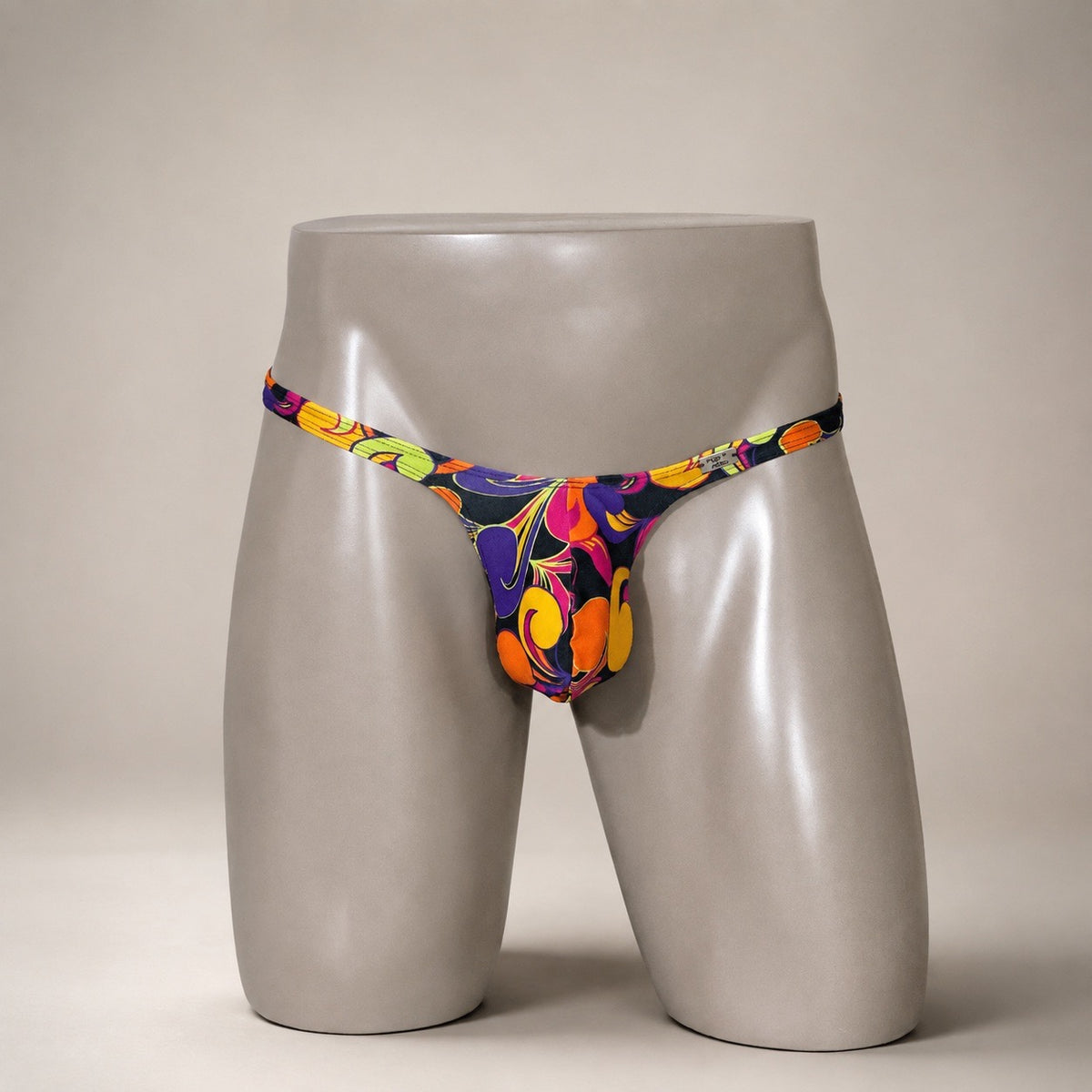 Front View of Disco Inferno Classic Thong multicolor retro men’s thong by PapiMalo Gear
