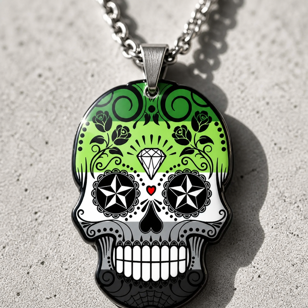 Aromantic pride sugar skull pendant necklace with green white black and gray decorative artwork on a concrete background