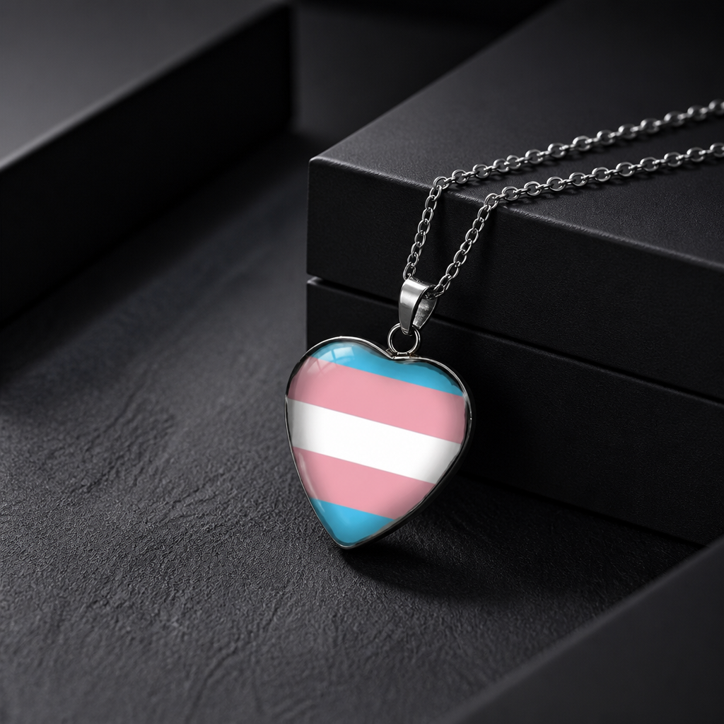 Transgender Pride Heart Pendant Necklace with glossy heart pendant featuring the transgender pride flag on a silver-tone chain on a black jewelry box