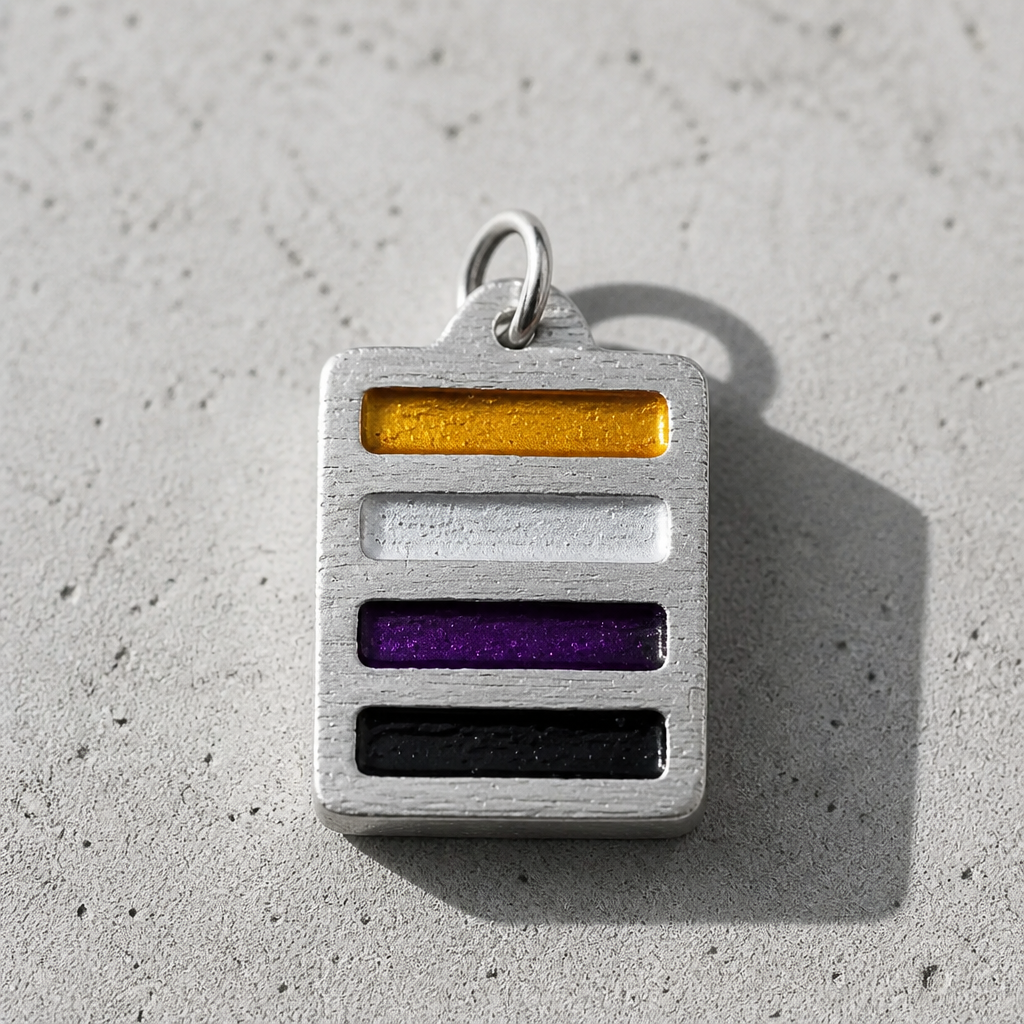 Handcrafted pewter pendant featuring the Nonbinary Pride flag in a contemporary geometric design on an adjustable black waxed cord on a concrete surface