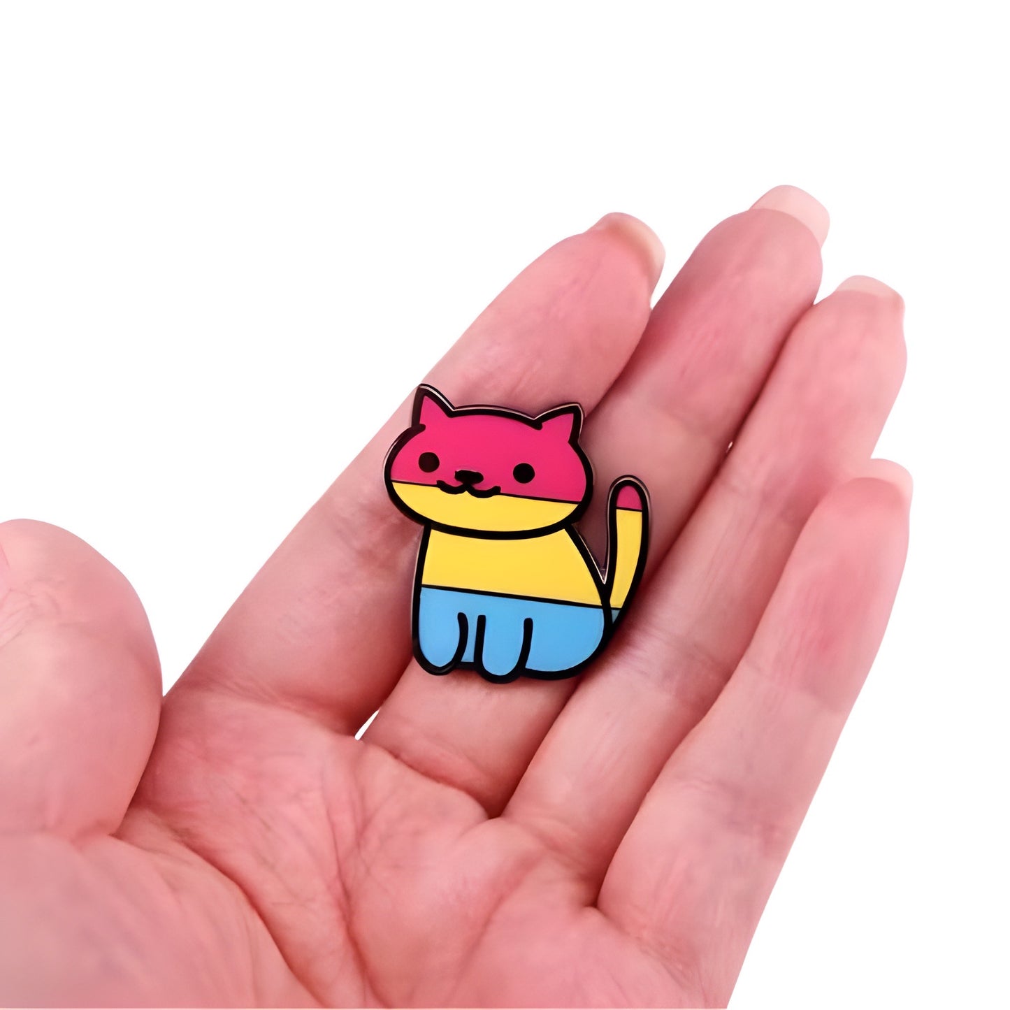 Pan Pride cat enamel pin featuring cute kitty design in pink yellow and blue pansexual flag colors held in a hand