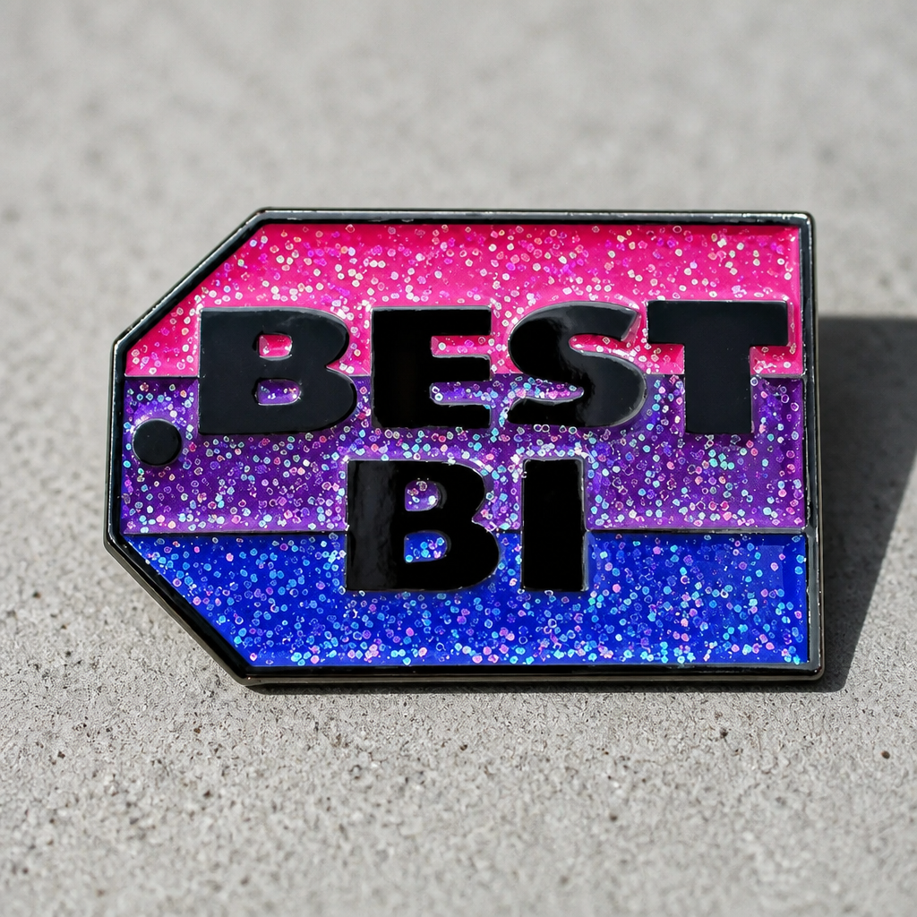 Glitter bisexual Pride enamel pin reading “Best Bi” in bold lettering on a concrete surface
