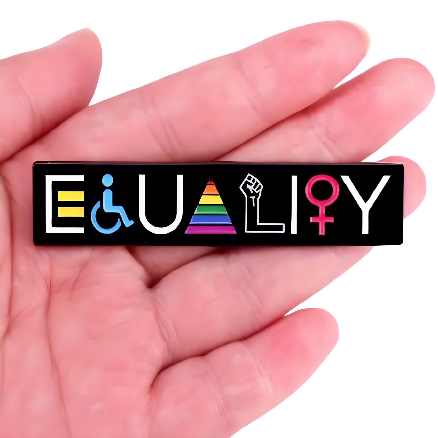 Large Equality Pride enamel pin featuring inclusive LGBTQ symbols and rainbow colors held in a hand