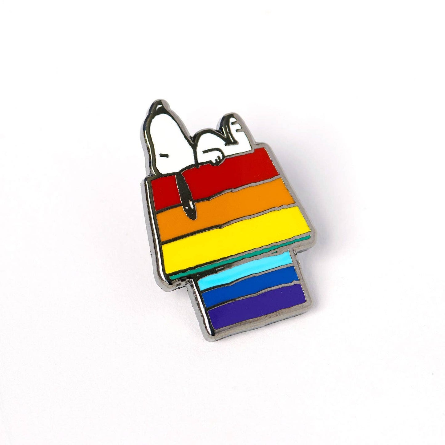 Official Peanuts enamel pin featuring Snoopy resting on a rainbow-colored doghouse