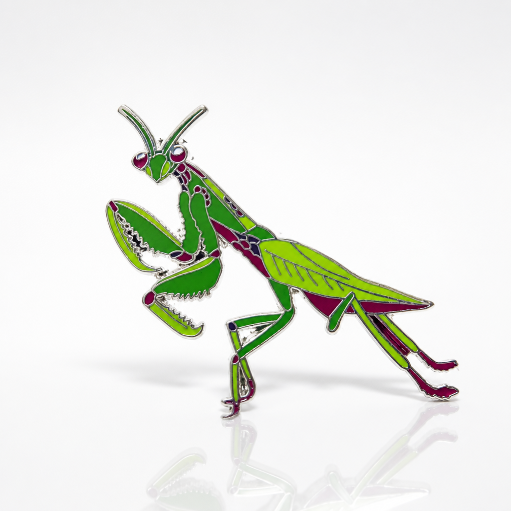 Silver-plated hard enamel pin featuring a detailed green and pink praying mantis insect design on a white background