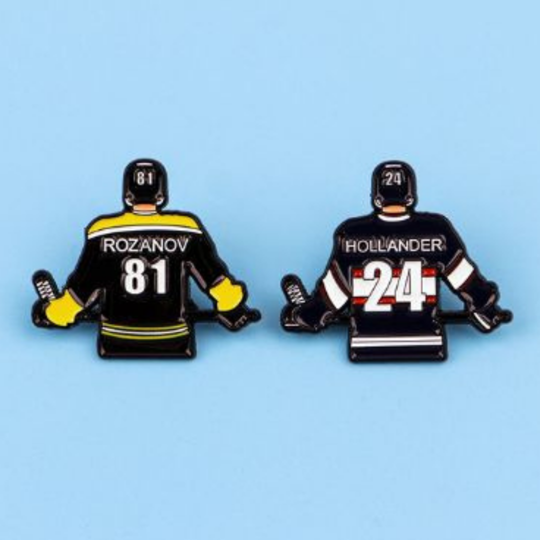 Fandom-inspired hockey jersey enamel pins featuring Rozanov and Hollander character references