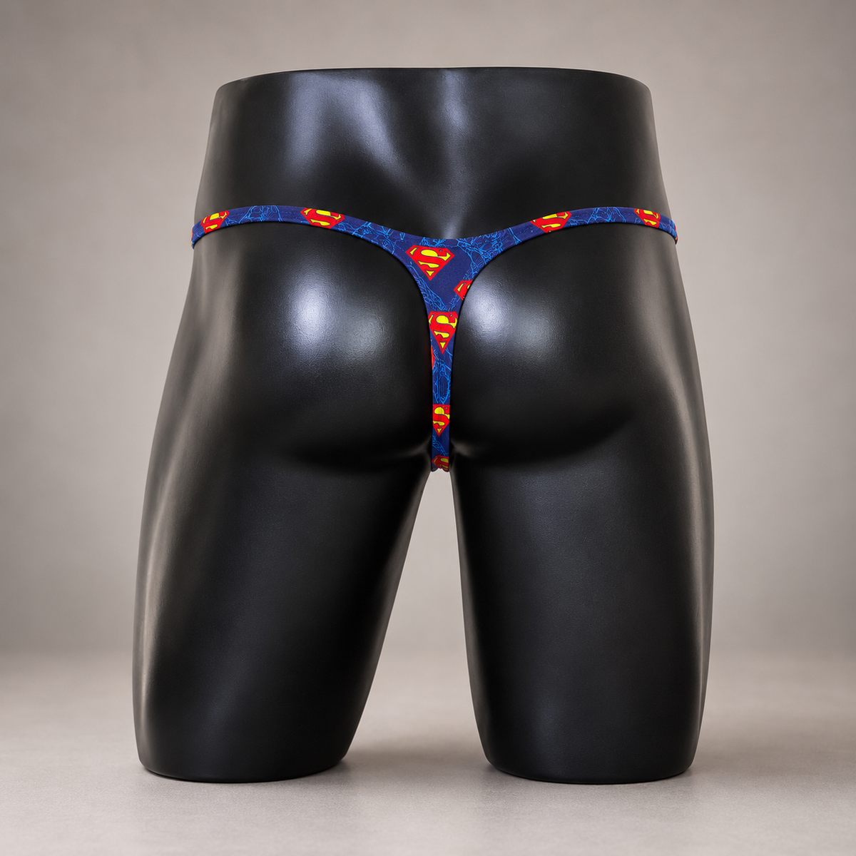Back view of Secret Identity Classic Thong featuring matching Superman print and minimal thong back, men's Classic thong by PapiMalo Gear.