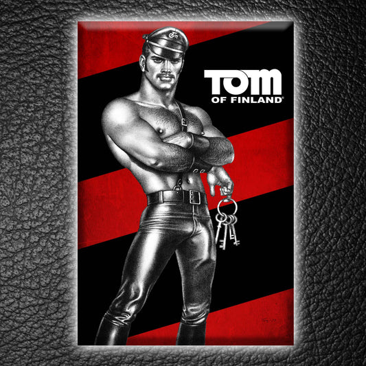 Official Tom of Finland "Keys" hard magnet featuring an iconic leather-clad character against a red and black background.