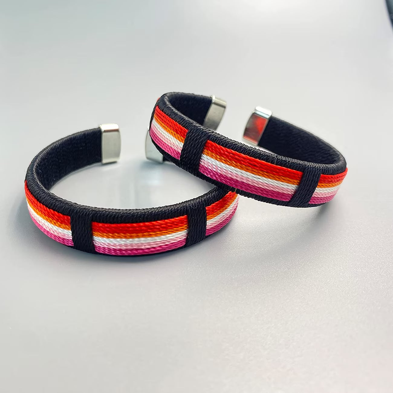 Lesbian pride woven cuff bracelet with colorful striped fabric design