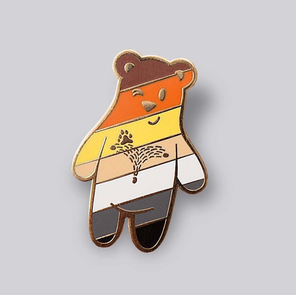 Cute Bear Buddy enamel pin featuring Bear Pride flag colors and smiling bear character artwork