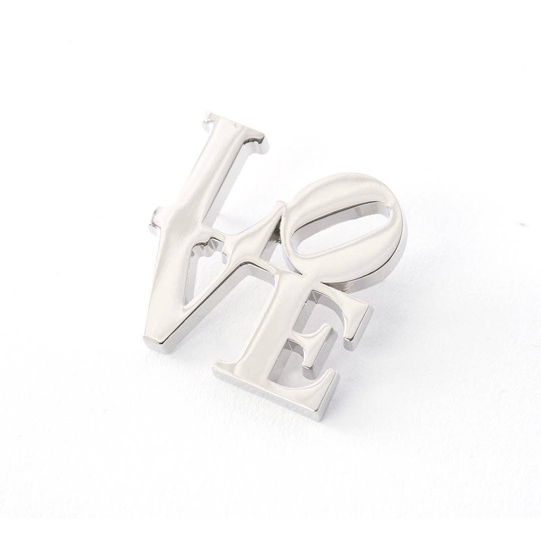Silver plated LOVE pin inspired by the iconic Robert Indiana artwork featuring the tilted O design