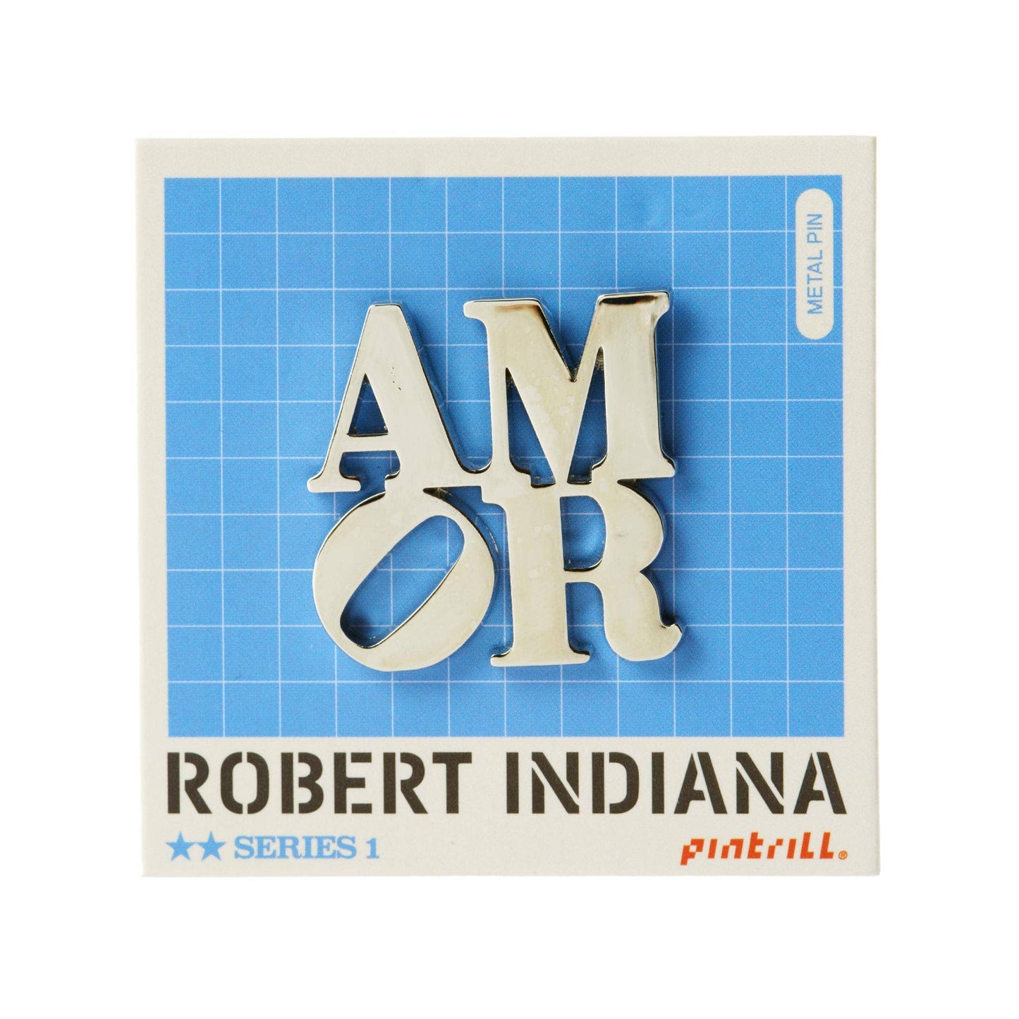 Officially licensed Robert Indiana AMOR enamel pin featuring the iconic stacked lettering in a polished silver finish, on a blue grid backing card