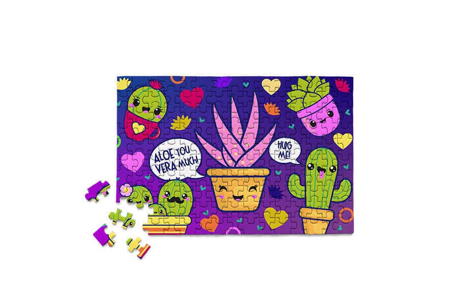 Aloe You Vera Much 150-piece Micro Puzzle featuring smiling succulents, cacti, and colorful plant-themed artwork.