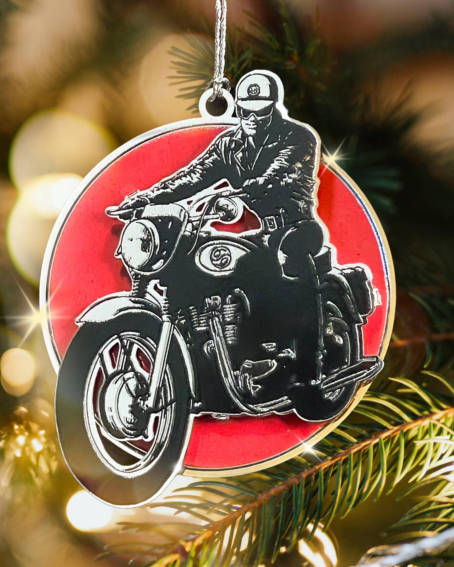 Tom of Finland limited edition biker metal ornament featuring a classic leather-clad motorcyclist on a red background 