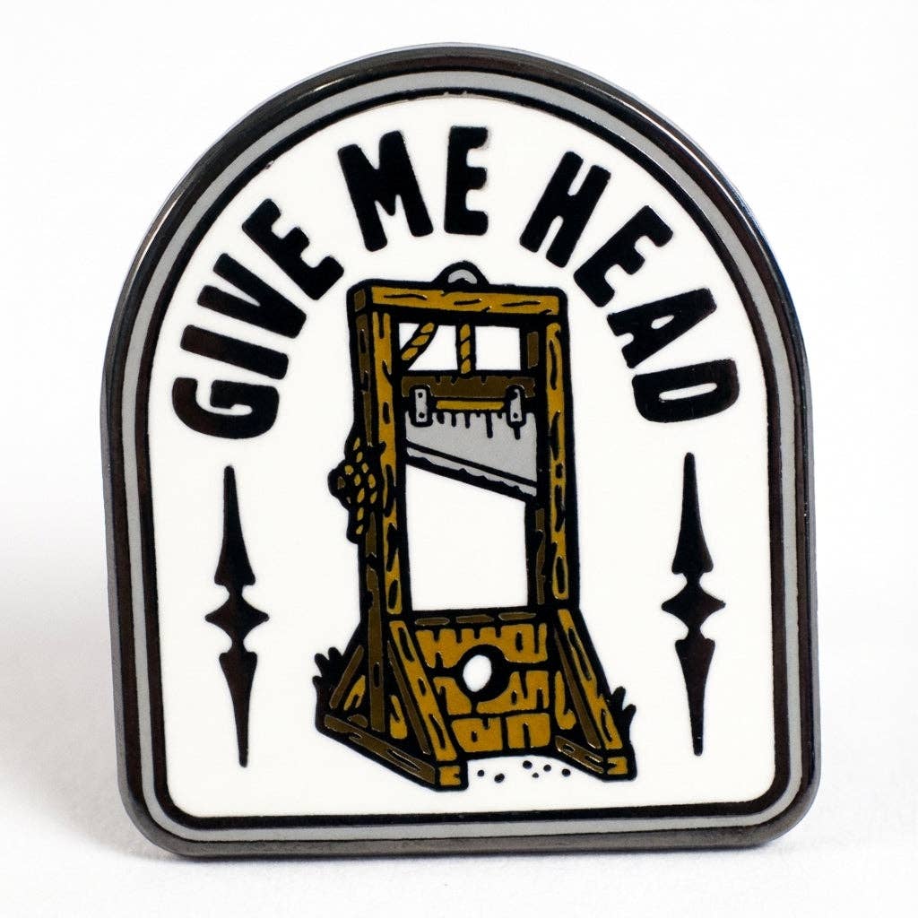 Give Me Head enamel pin featuring a vintage guillotine illustration and humorous text