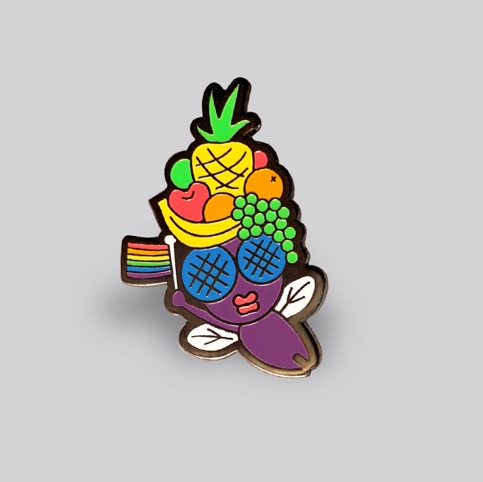 Fruit Fly enamel pin featuring a colorful fruit-inspired fly with rainbow wing detail