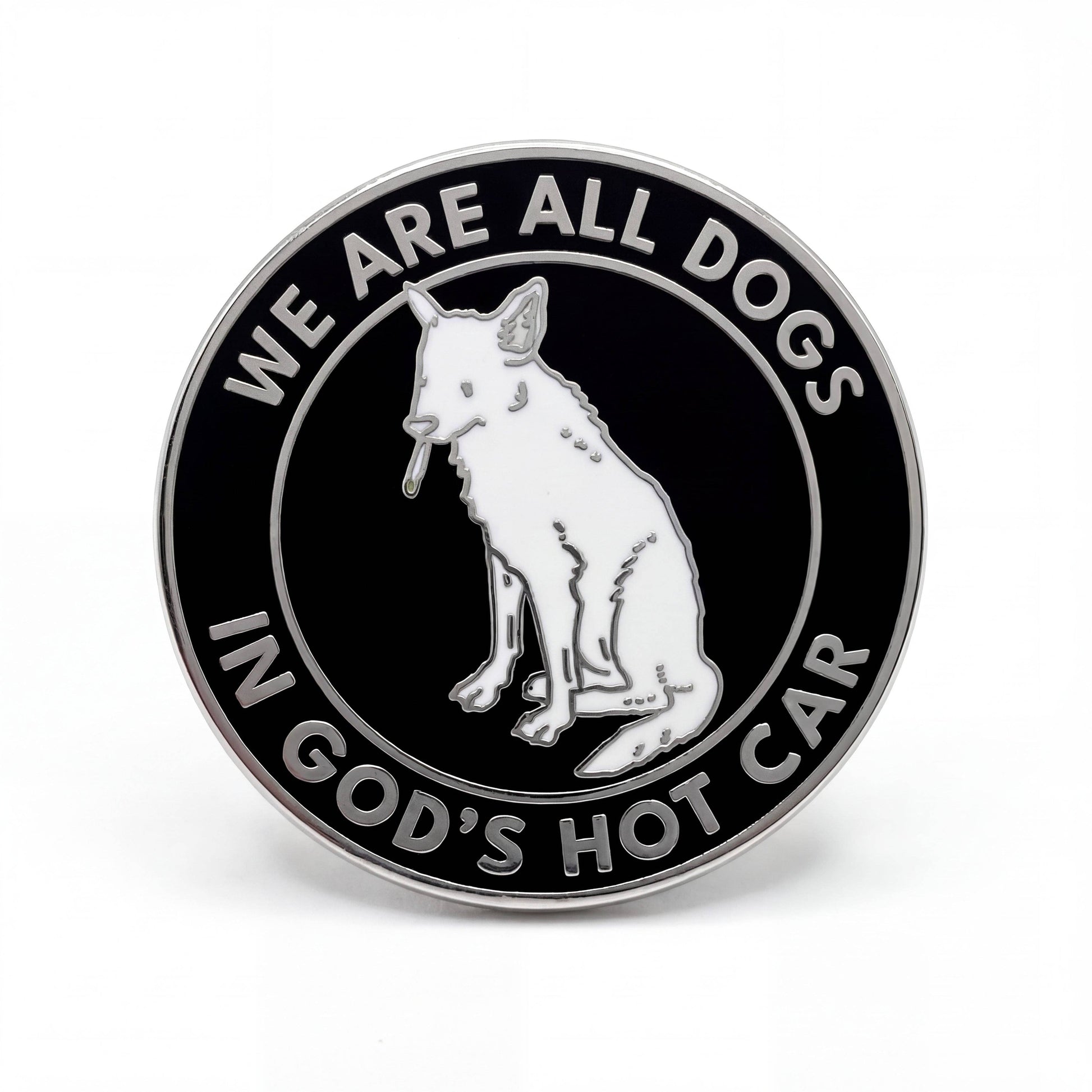 Black and silver hard enamel pin featuring a dog illustration and the phrase We Are All Dogs in God's Hot Car