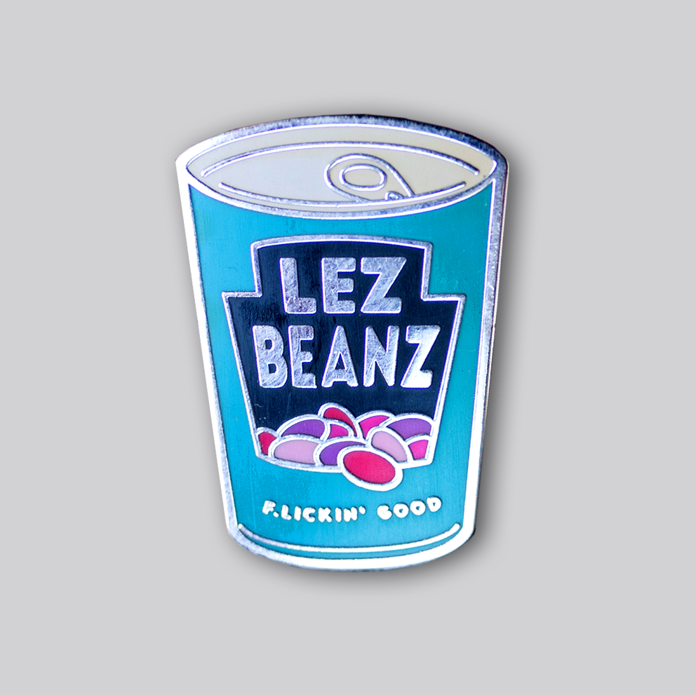 Lez Beanz enamel pin featuring a retro-style can of beans with playful lesbian pride humor
