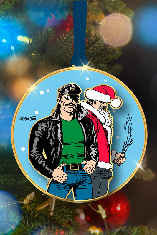 Limited edition Tom of Finland Leather & Santa metal ornament featuring a leather-clad character standing with Santa