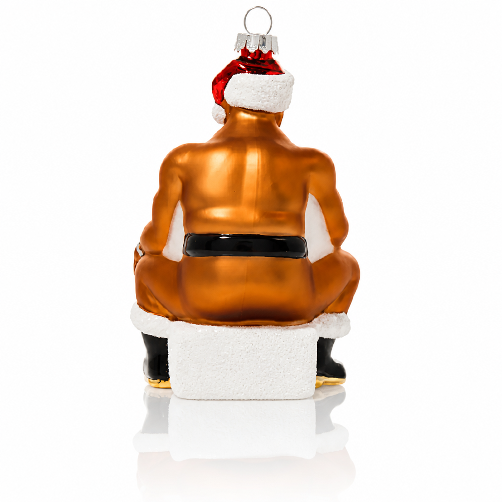 rear view of Hand-painted glass Christmas ornament featuring a muscular bearded Santa sitting on the naughty stool wearing a Santa hat and boots.