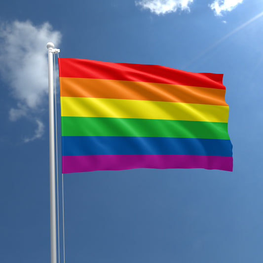 Classic Rainbow Pride outdoor flag with six rainbow stripes against a blue sky