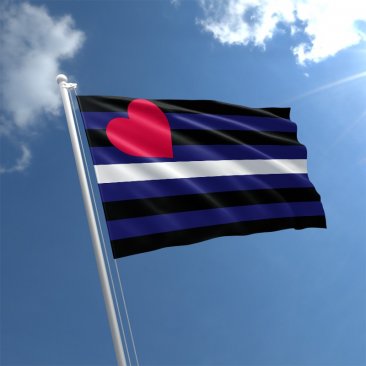 Leather Pride outdoor flag with black blue white stripes and red heart against a blue sky