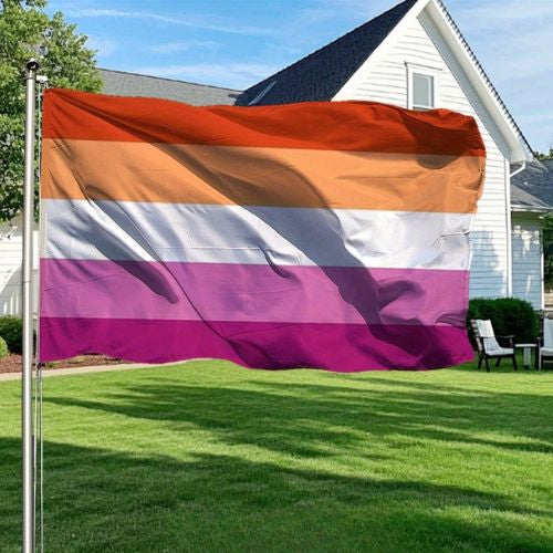 Sunset 5 Stripe Lesbian Pride outdoor flag with orange pink and white stripes in front of a house