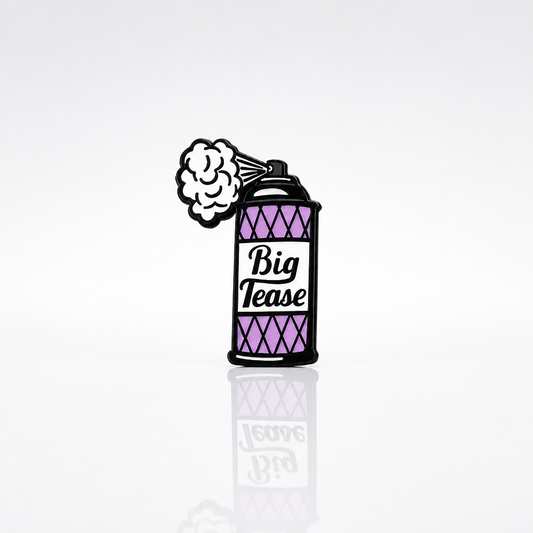 Enamel pin shaped like a retro spray can labeled Big Tease with a puff of spray coming from the nozzle