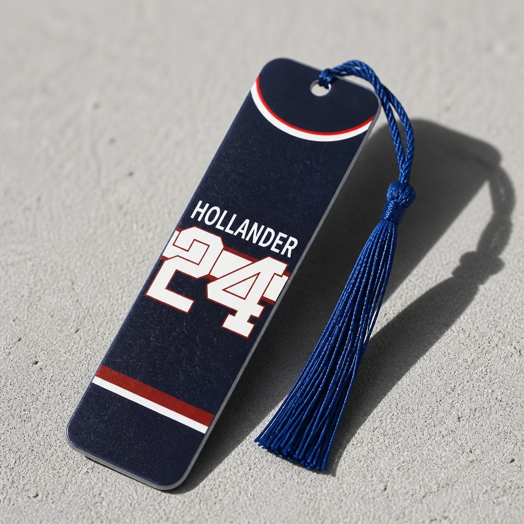 Double-sided Heated Rivalry steel bookmark featuring Hollander #24 on one side and Rozanov #81 on the reverse with blue tassel.