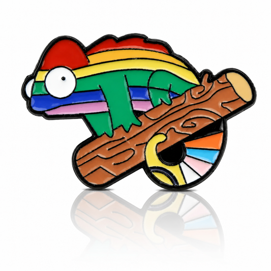 Rainbow chameleon Pride enamel pin perched on a branch