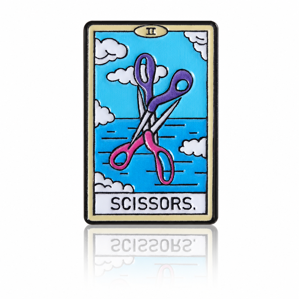 Lesbian tarot enamel pin with crossed pink and purple scissors against a blue sky