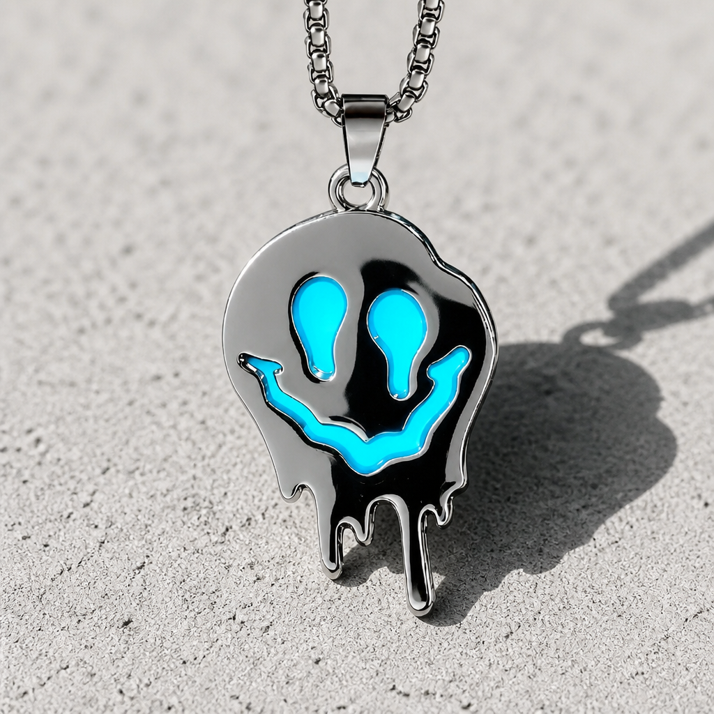 Glow-in-the-dark blue ghost pendant necklace with polished stainless steel finish