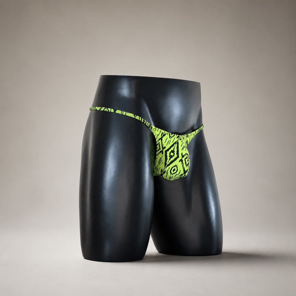 Angled front view of Acid Ikat neon geometric men's Muscle thong by PapiMalo Gear