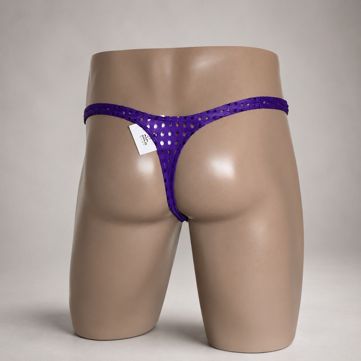 Back view of Purple Rush purple perforated men’s Classic thong by PapiMalo Gear