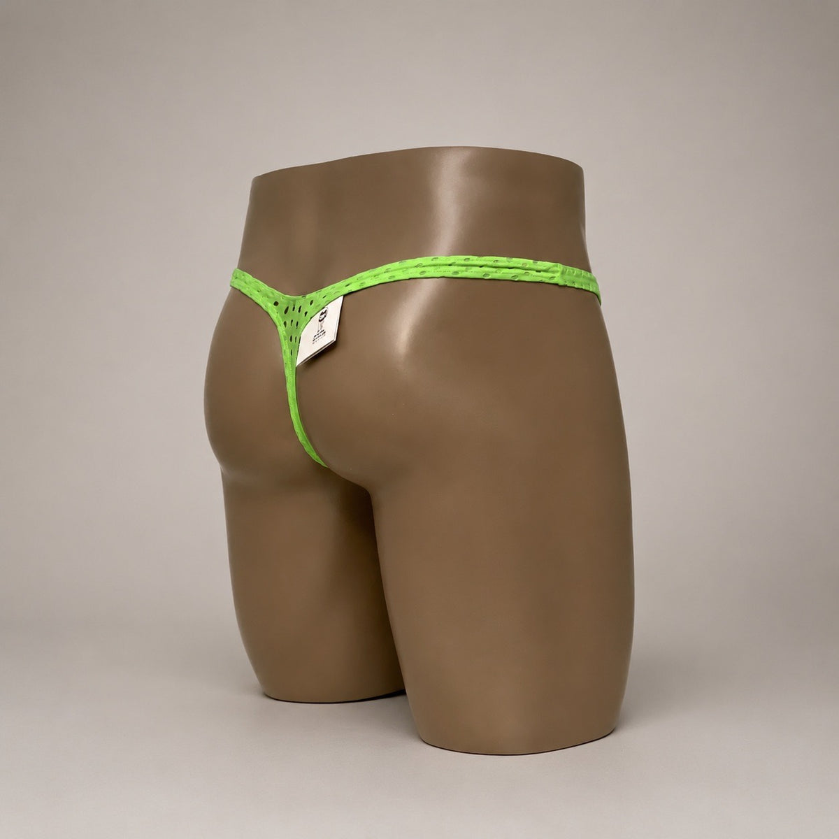 Rear side view of Neon Charge neon green perforated men’s Classic thong by PapiMalo Gear