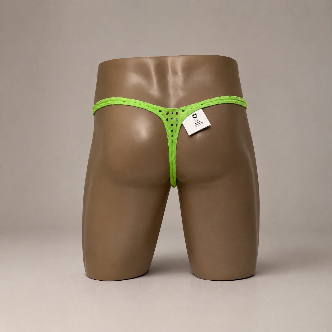 Back view of Neon Charge neon green perforated men’s Classic thong by PapiMalo Gear