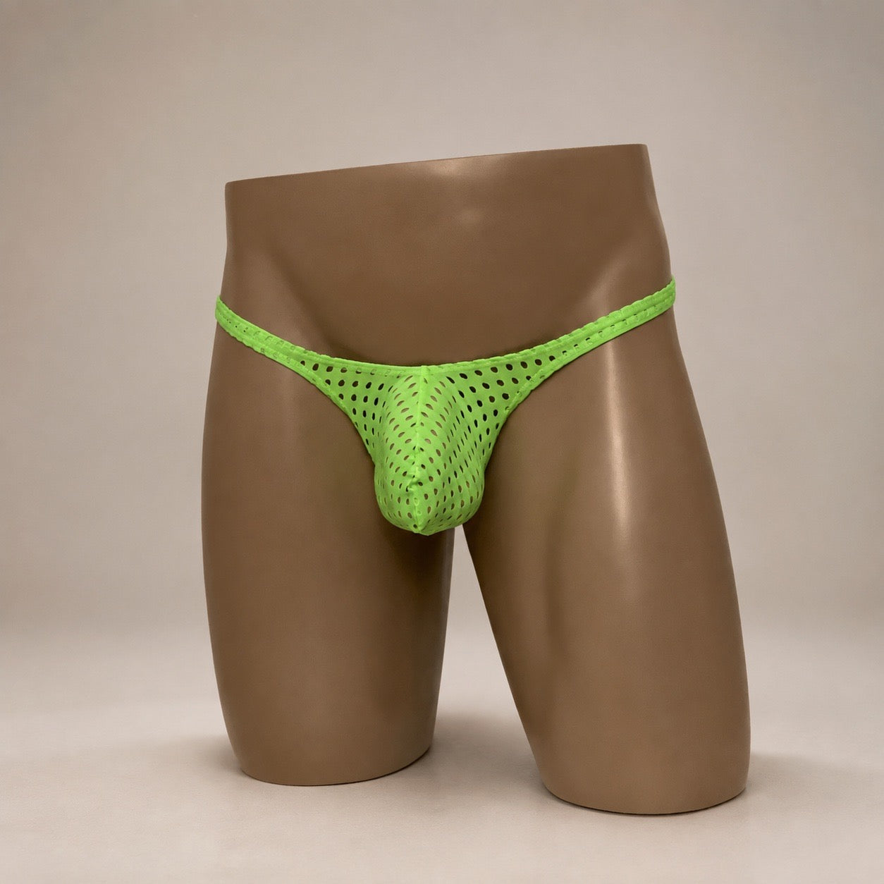 Front view of Neon Charge neon green perforated men’s Classic thong by PapiMalo Gear