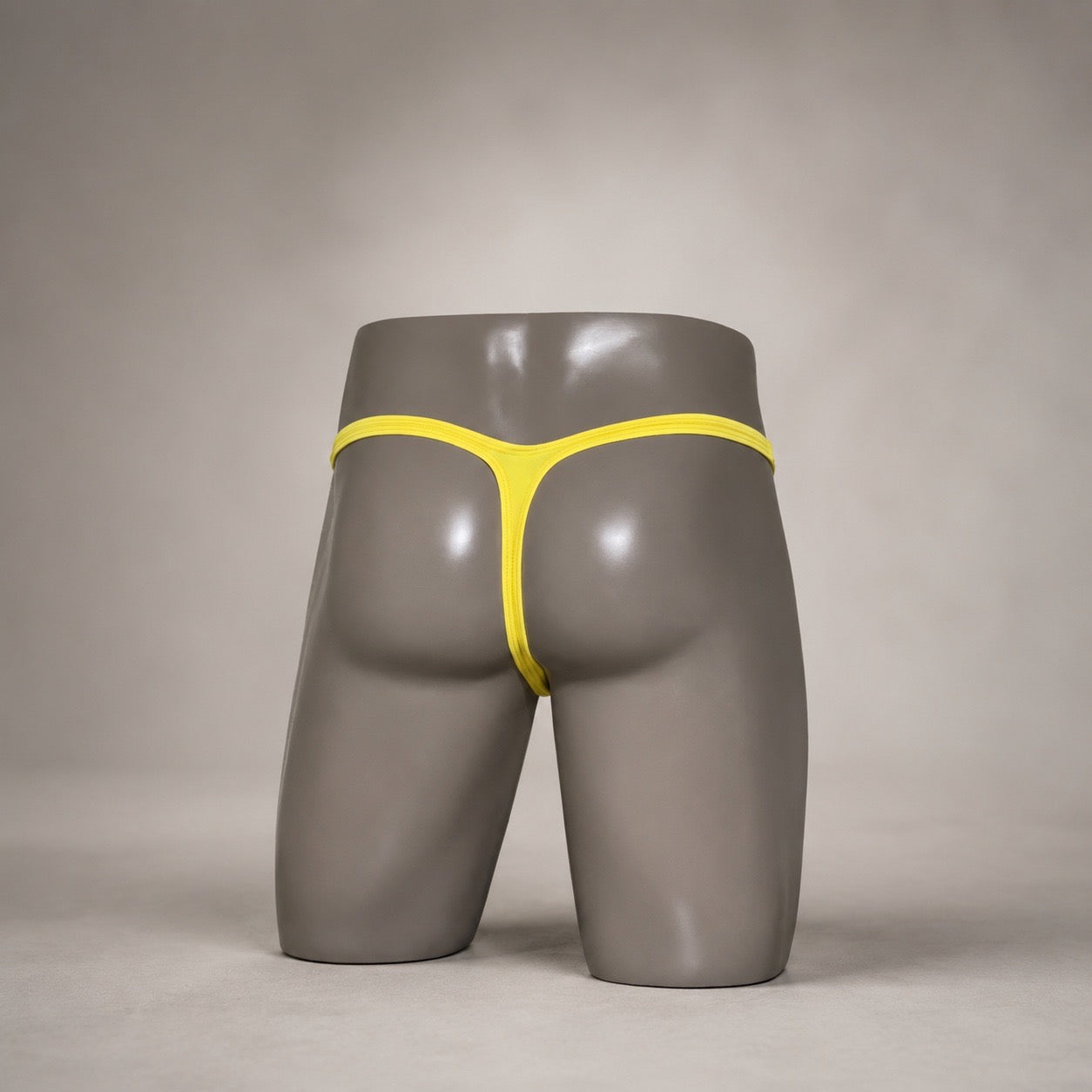 Back view of Solar Flash bright yellow men’s Classic thong by PapiMalo Gear