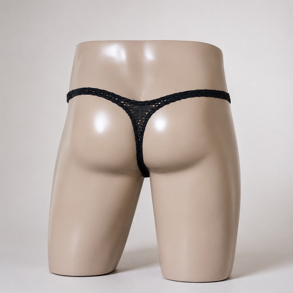 Back view of Blackout black open mesh men’s Classic thong by PapiMalo Gear