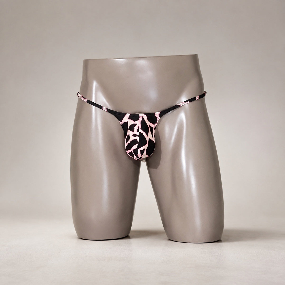 Front View of Pink Safari black and pink animal-print men's Muscle thong by PapiMalo Gear