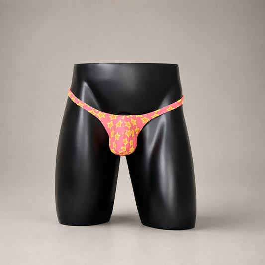 Front View of Star Power hot pink and yellow star-print men’s Classic thong by PapiMalo Gear