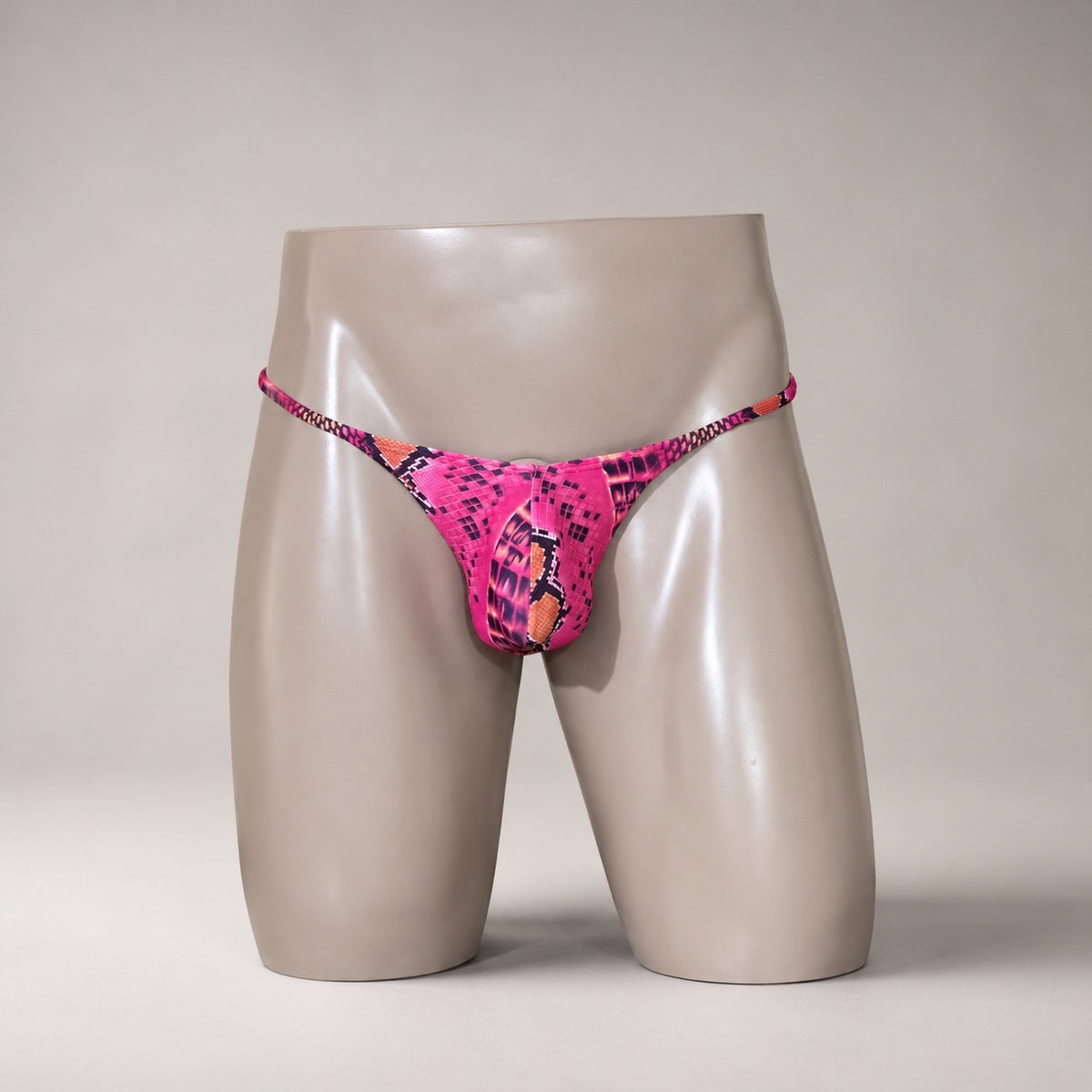 Front View of Disco Python pink and black snakeskin-inspired men’s Muscle thong by PapiMalo Gear