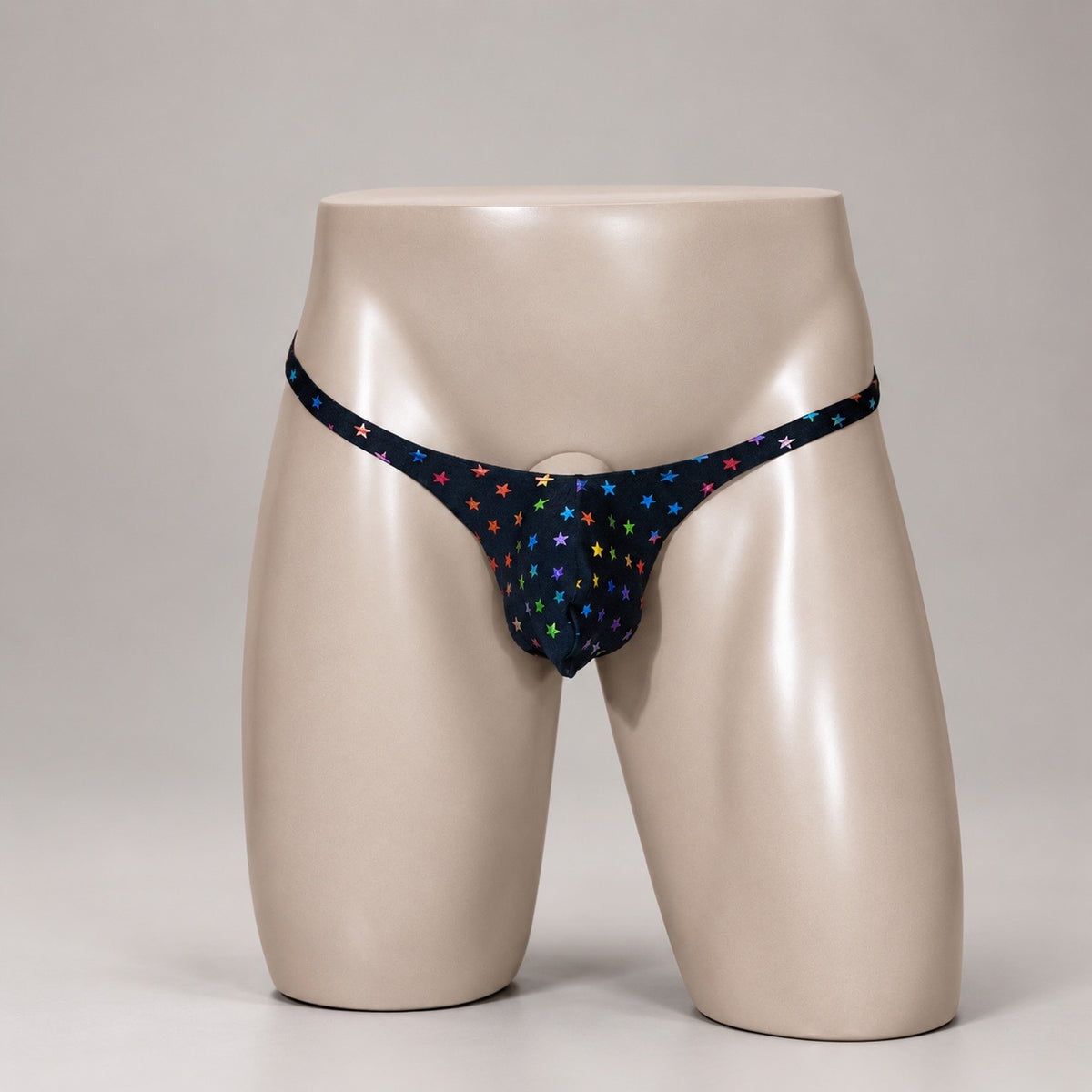 Front View of Rainbow Stardust black men’s Muscle thong with multicolor stars by PapiMalo Gear