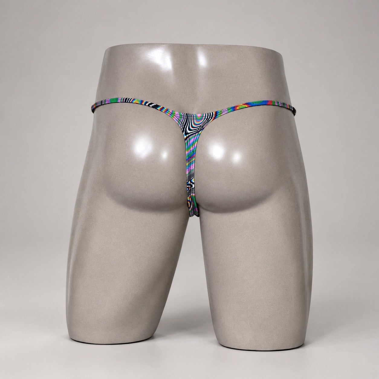 Rear View of Kaleidoscope Drift multicolor optical-print men’s Muscle thong by PapiMalo Gear