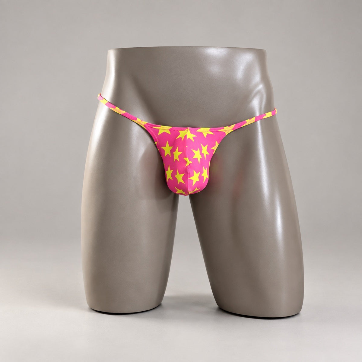 Front View of Popstar Muscle Thong with hot pink and yellow-green stars by PapiMalo Gear