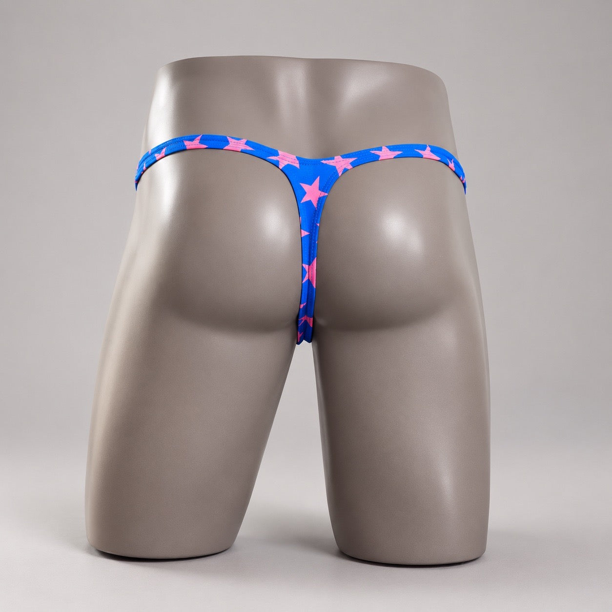 Rear View of Electric All-Star Classic Thong blue and pink star men’s thong by PapiMalo Gear