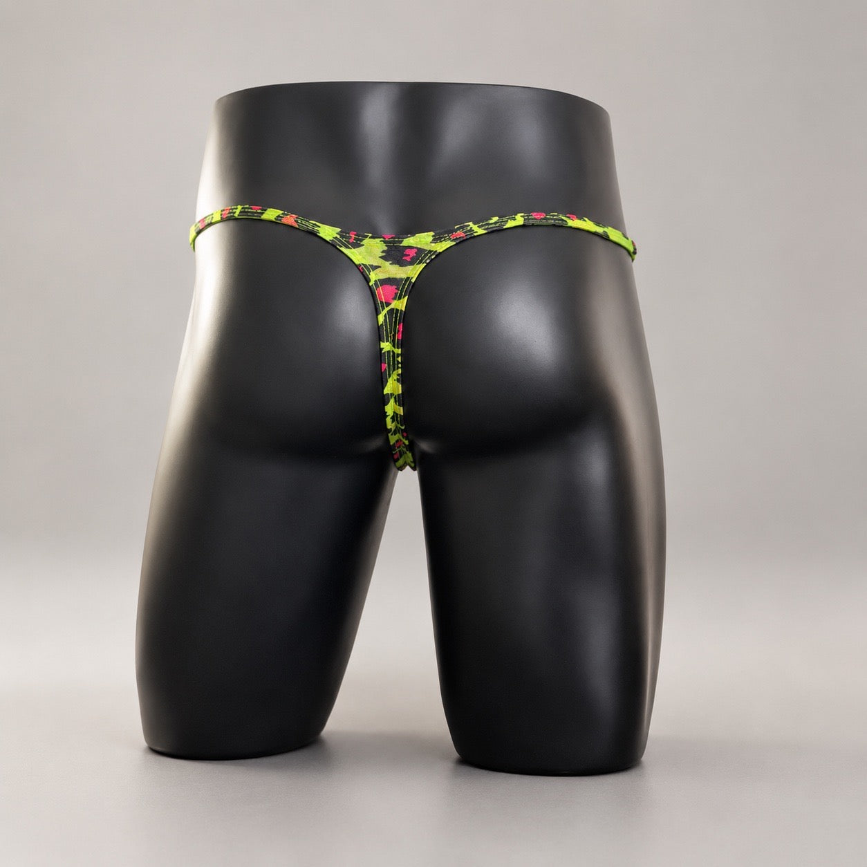 Rear View of Acid Cat Muscle Thong with narrow neon leopard thong back by PapiMalo Gear