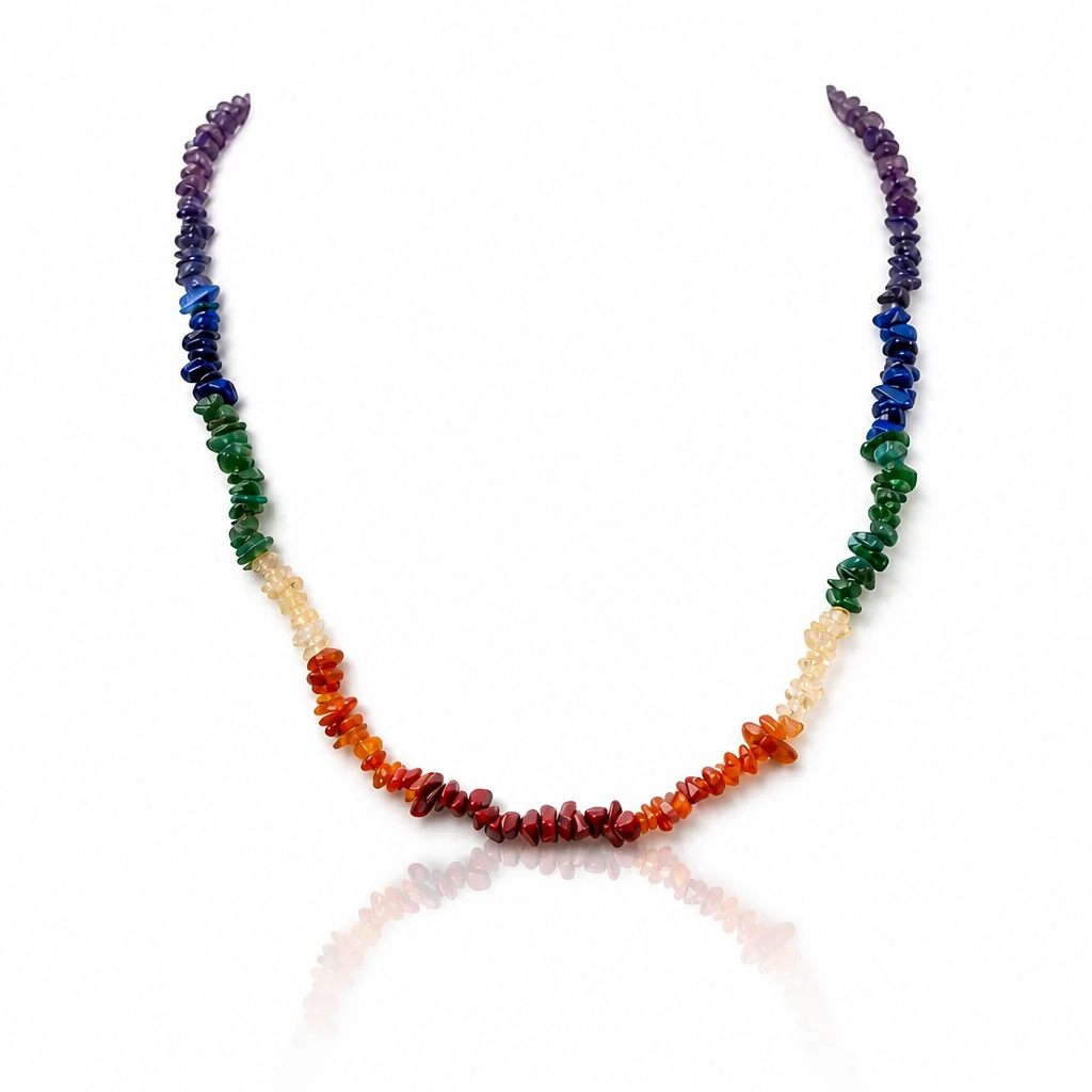 Artisan chakra gemstone necklace made with colorful natural stone chips arranged in traditional chakra colors.