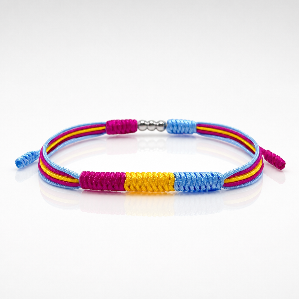 Pansexual Pride braided cord bracelet with adjustable closure in pink yellow and blue pride colors on a white surface